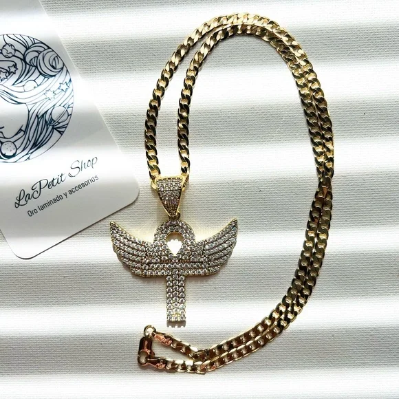 Cuban link chain with ansata cross pendant and wings polished in zirconia.